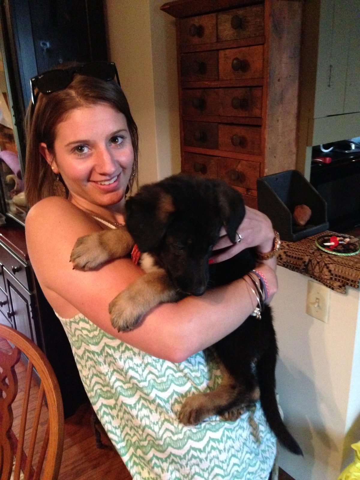 Abby holding a puppy